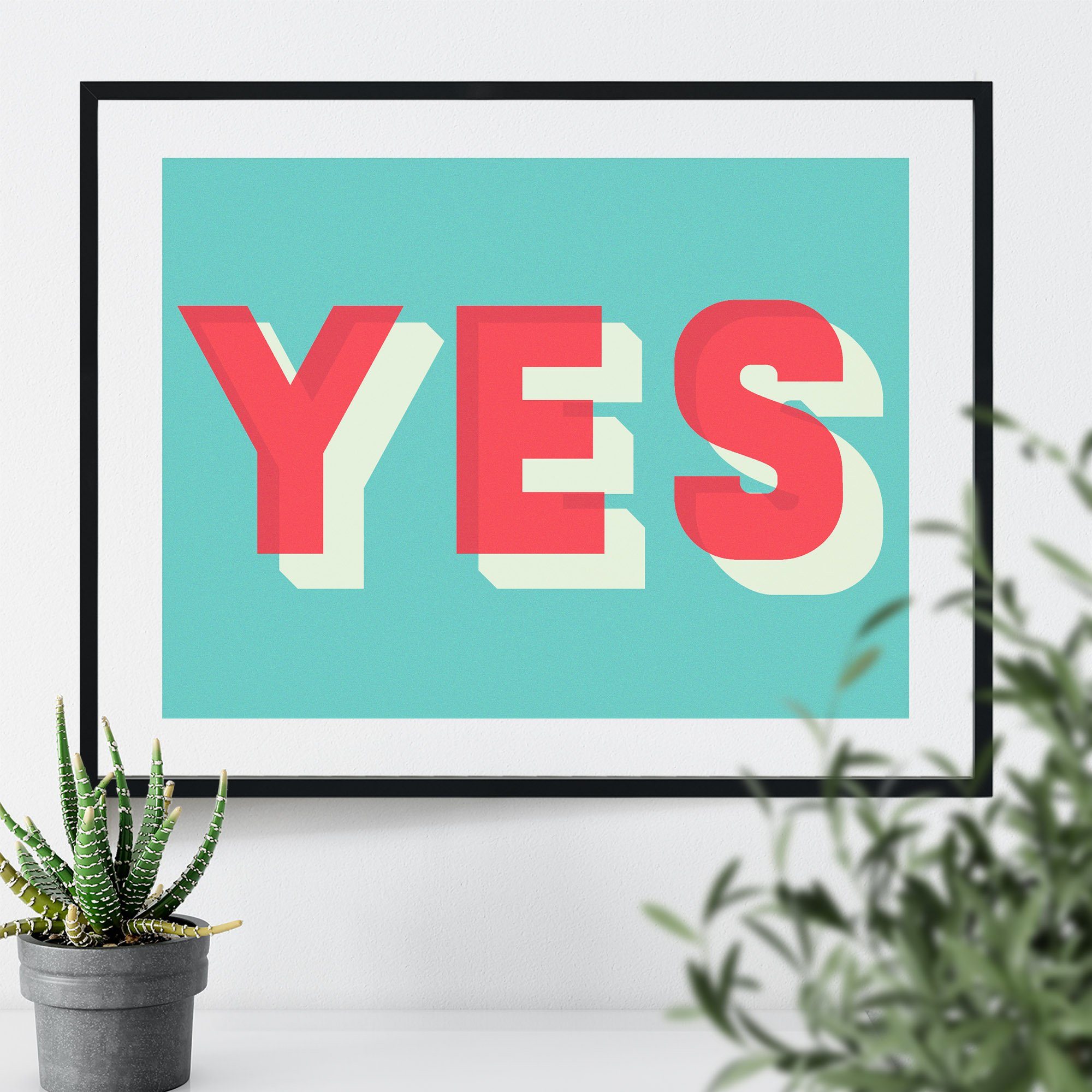 Large framed print of the word YES