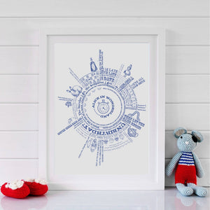 Framed print with blue typographic text printed in a circular design with quotes from the book Alice in Wonderland