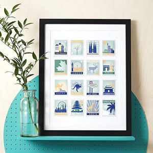 Black framed print with 16 green and navy toned stamp designs on a white background.