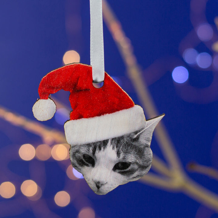 Personalised cat Christmas tree decoration with Santa hat, custom wooden bauble for pet lovers, white ribbon hanger.