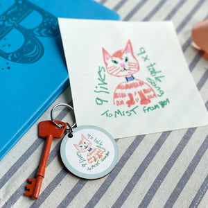 Wooden keyring printed with a child's drawing