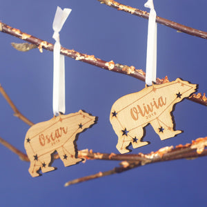 Personalised wooden Christmas decorations in the shape of a polar bear