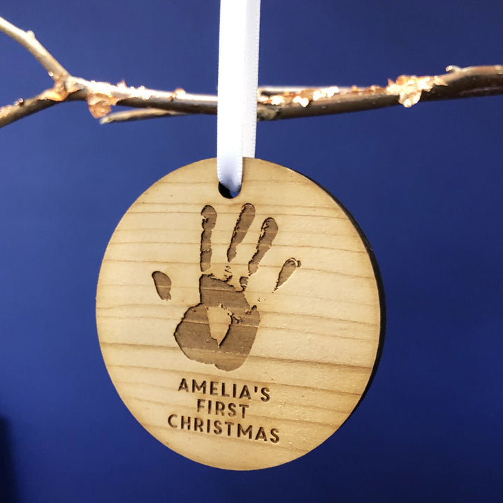 Baby’s first Christmas wooden bauble with custom handprint or footprint.