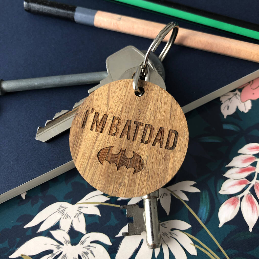 Round wooden keyring engraved with "I'm batdad" and a bat logo