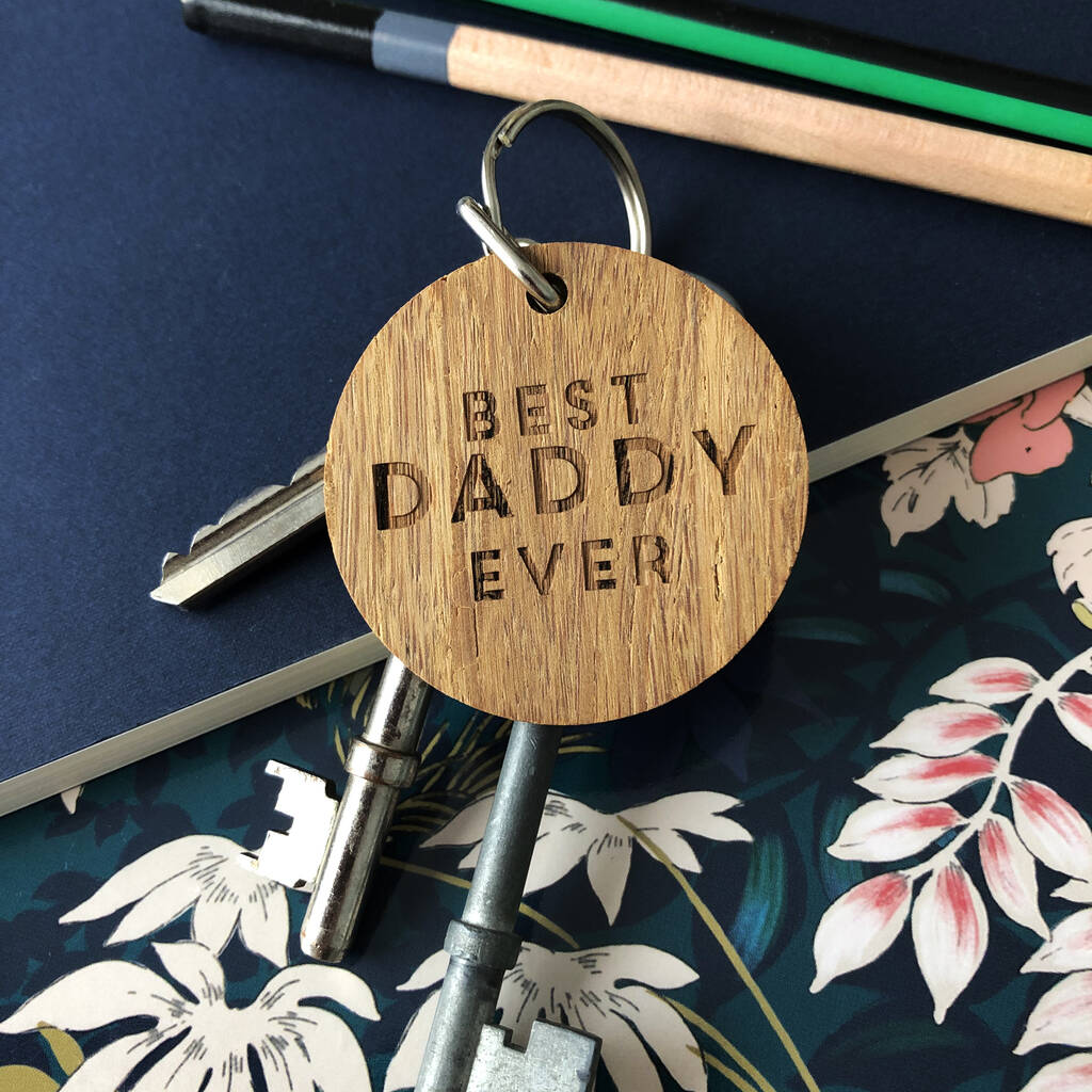 Round wooden keyring with the text "Best Daddy Ever" engraved in capitals on the front.