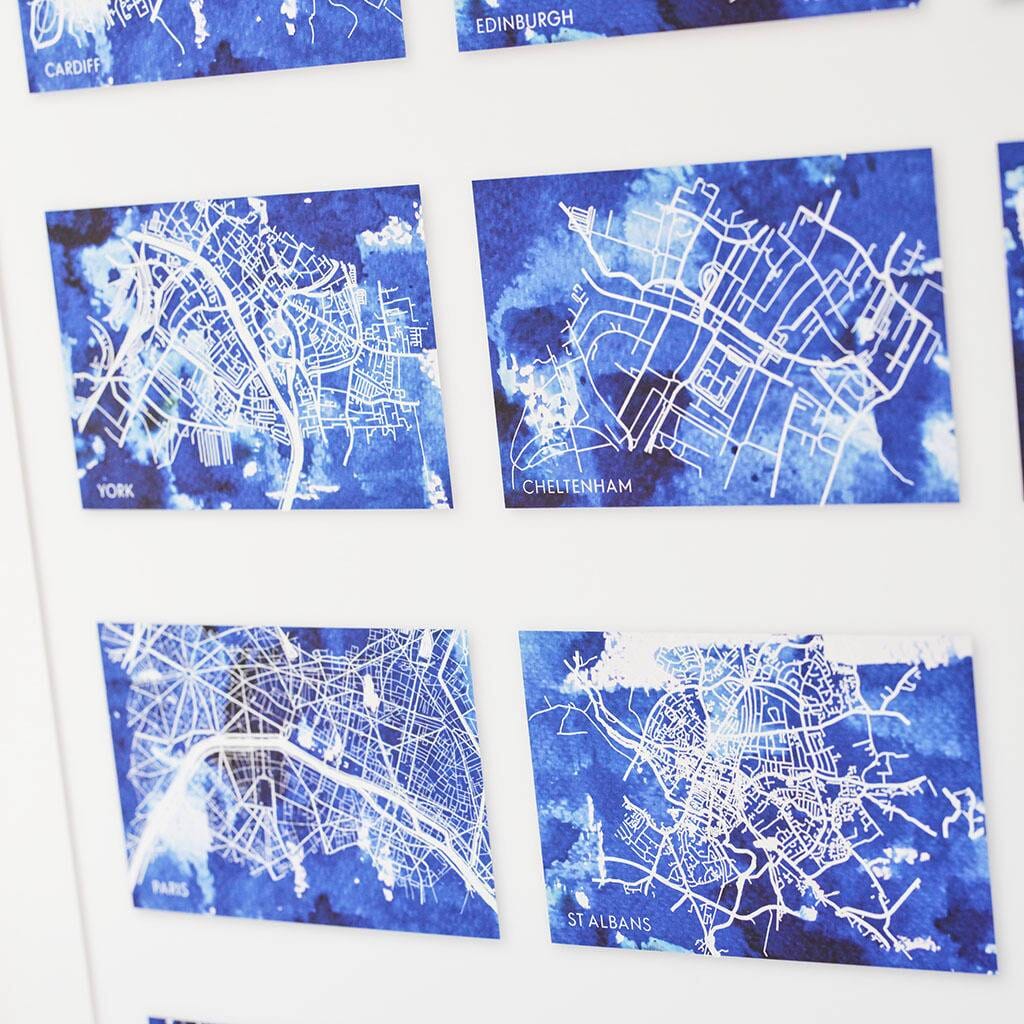 Close up of print with 15 small blue maps of different locations