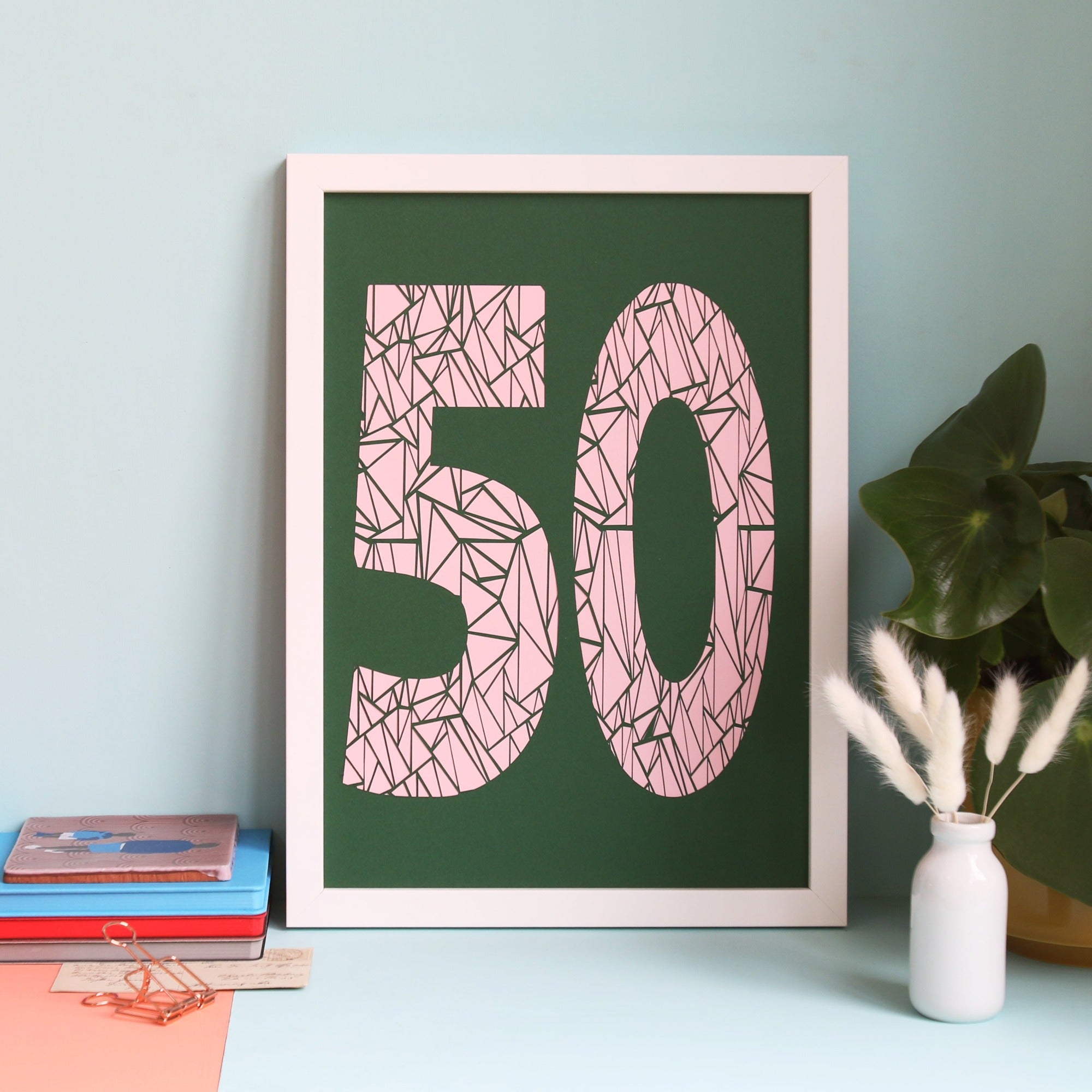 Framed geometric number 50 papercut in green and pink colourways