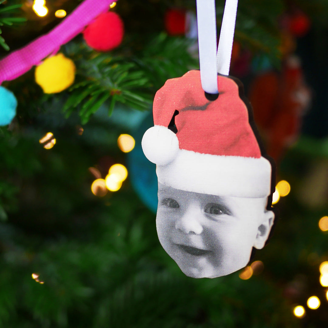 Custom Christmas tree ornament with babywearing Santa hat design.