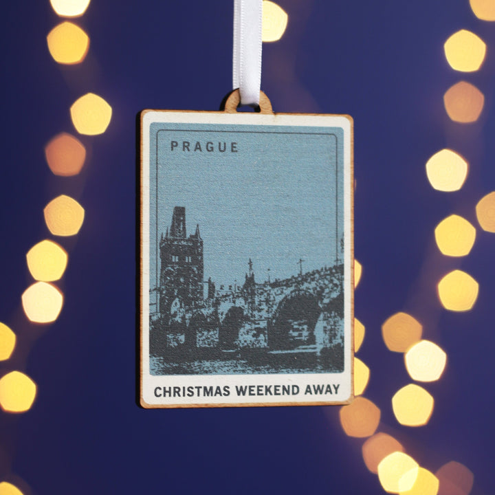 Wooden Christmas decoration with a picture representing Prague printed on it. available to be customised with different locations, making it a great way to remember holidays.