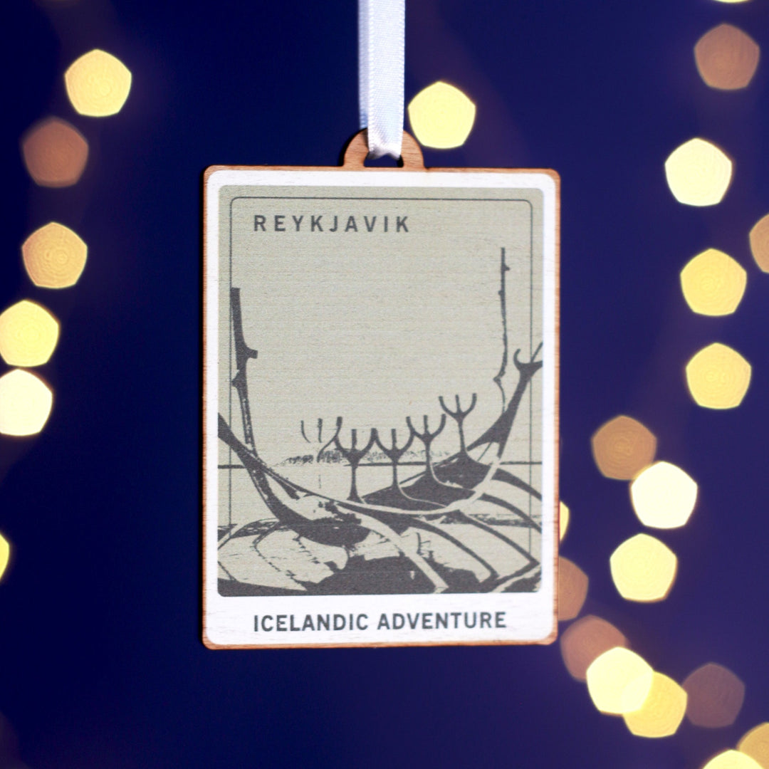 Wooden custom bauble for Christmas decorations with a picture representing Reykjavik printed on it. Different locations available.