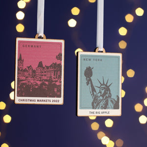 Wooden Christmas decorations with a printed picture of a travel destination e.g New York