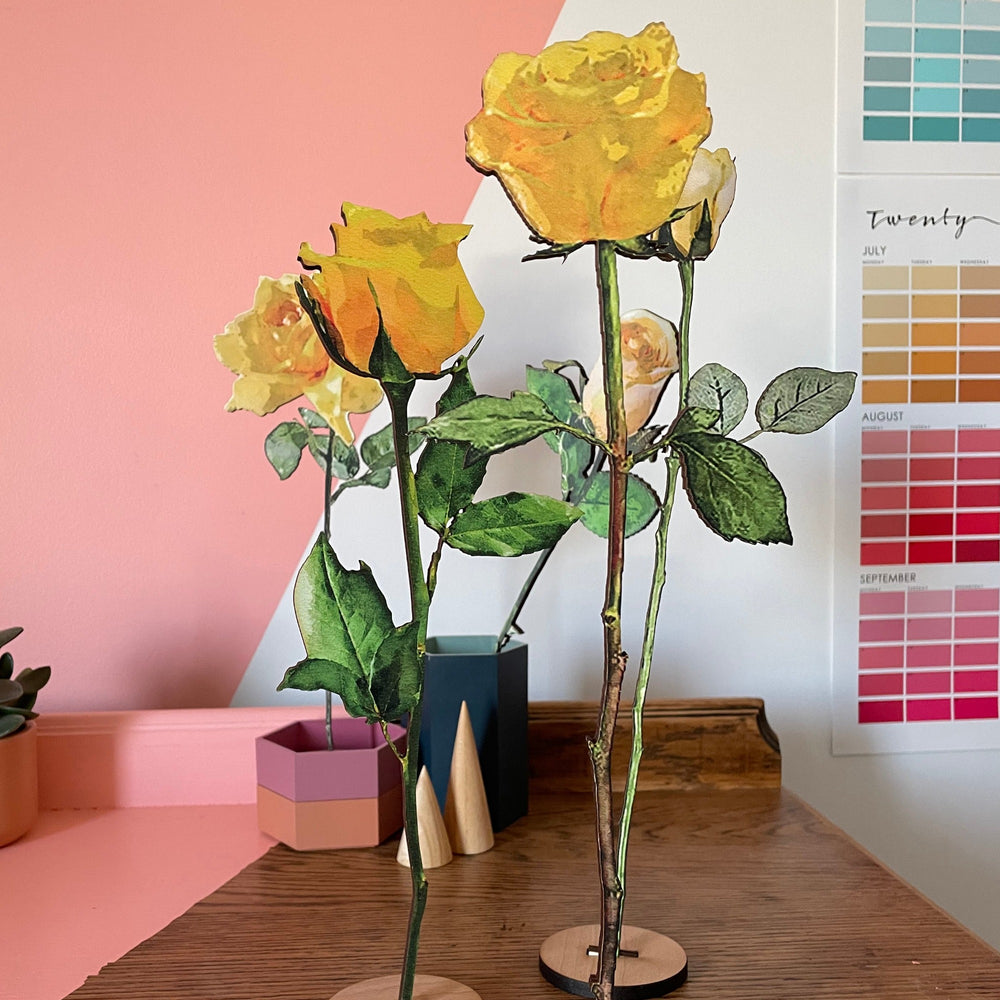 Bouquet of wooden yellow roses on a wooden stand